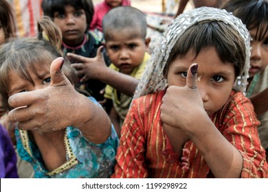  Pakistani Children Shows Her Finger Marked With Ink On A Fingertip That Shows She Received A Polio Vaccine At A School Slum In Lahore, Pakistan, April 18, 2016. 