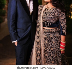 Pakistani Groom and bride showing wedding dress