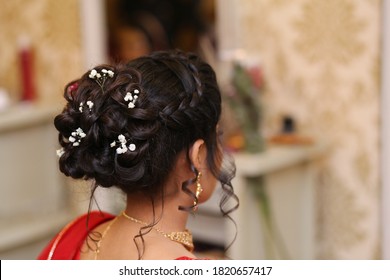 Pakistani Indian bridal showing beautiful flower bun hairstyle