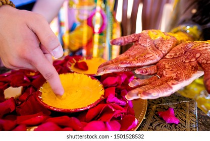 Pakistani Indian bridal showing hands with turmeric haldi paste