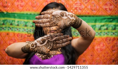 Pakistani Indian bridal showing mehndi design her sangeet day