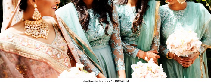 Pakistani Indian Bride With Bridesmaids Showing Wedding Dres
Lahore, Pakistan, 31, August, 2019 