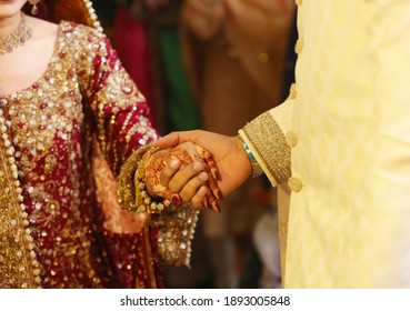 Pakistani Indian Bride Holding Hands At Their Wedding Day 
Karachi, Pakistan, 01- December 2018