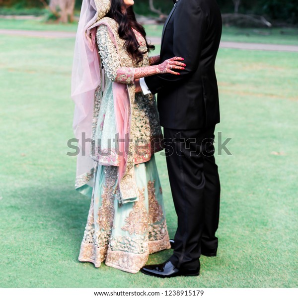 Pakistani Indian Couples Wedding Reception Attire Stock Photo