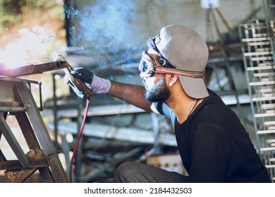 Pakistani Or Indian Professional Welder Worker Welding Metal At Workshop With Electric Welding Rod