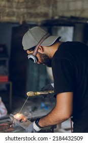 Pakistani Or Indian Professional Welder Worker Welding Metal At Workshop With Electric Welding Rod