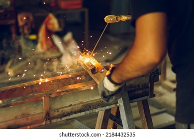 Pakistani Or Indian Professional Welder Worker Welding Metal At Workshop With Electric Welding Rod