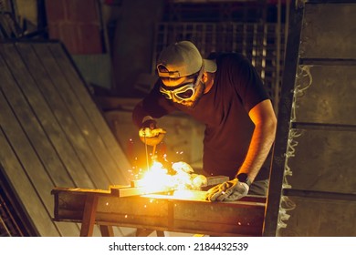 Pakistani Or Indian Professional Welder Worker Welding Metal At Workshop With Electric Welding Rod