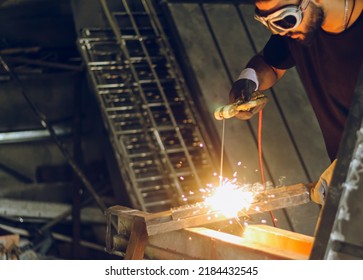 Pakistani Or Indian Professional Welder Worker Welding Metal At Workshop With Electric Welding Rod