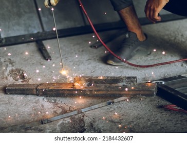 Pakistani Or Indian Professional Welder Worker Welding Metal At Workshop With Electric Welding Rod