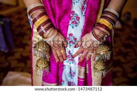 Pakistani Indian showing hands mehndi design and wedding bangles