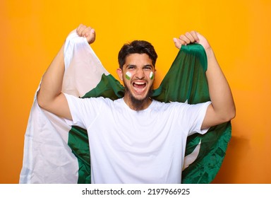 Pakistani, Indian, South Asian cricket fan celebrating victory or showing excitement for cricket - Powered by Shutterstock