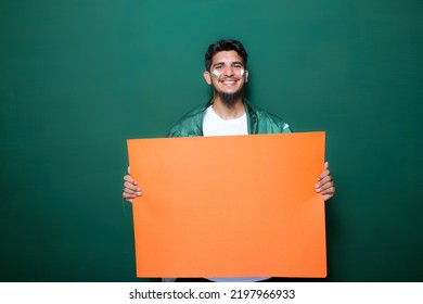 Pakistani, Indian, South Asian Cricket Fan Holding Play Card In Happy Mood