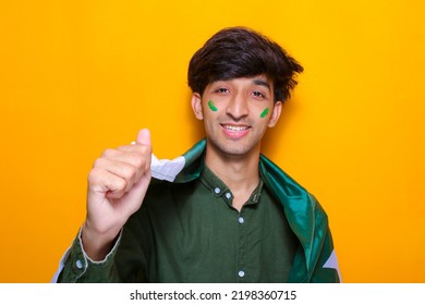 Pakistani, Indian, South Asian Young Boy Holding Flag Celebrating Or Cheering Pakistan Cricket Team, Cricket Fan Concept