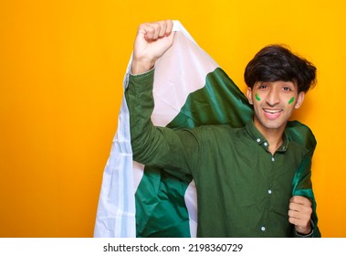 Pakistani, Indian, South Asian Young Boy Holding Flag Celebrating Or Cheering Pakistan Cricket Team, Cricket Fan Concept