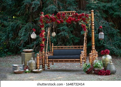 Pakistani Indian wedding sangeet Jhoola stage with flower decoration