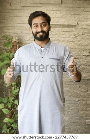 Pakistani men wearing shalwar kameez point finger, Asian man,
mature model