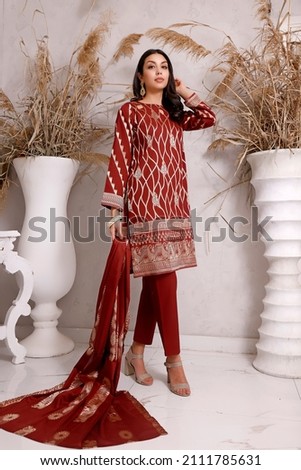 A Pakistani model is standing on Studio Shoot.