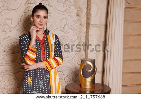 A Pakistani Model is wearing traditional dress Shalwar kameez - Kurti