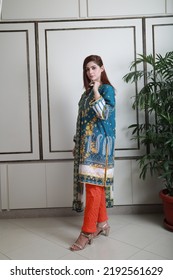 A Pakistani Shalwar Kameez Suit With Dupatta. Pakistani Model Is Shown Her Dress With Style.