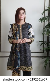 A Pakistani Shalwar Kameez Suit With Dupatta. Pakistani Model Is Shown Her Dress With Style.