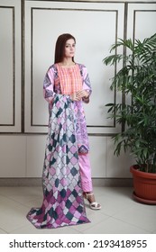 A Pakistani Shalwar Kameez Suit With Dupatta. Pakistani Model Is Shown Her Dress With Style.