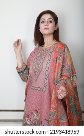 A Pakistani Shalwar Kameez Suit With Dupatta. Pakistani Model Is Shown Her Dress With Style.