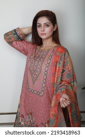 A Pakistani Shalwar Kameez Suit With Dupatta. Pakistani Model Is Shown Her Dress With Style.