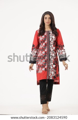 A Pakistani woman is showing her dress. Shalwar kameez, Kurti