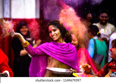 Pakistan,Lahore A Girl  Dance And Throw Brightly Coloured Powder At The Holi Festival Of Colours In Lahore On March 24,2016. 