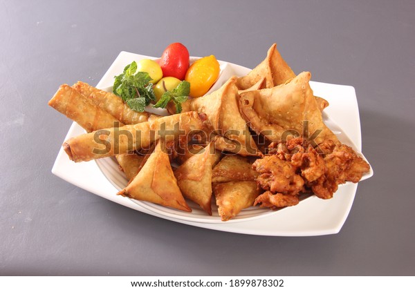 pakora samosa chicken roll fast food Pakistani\
Indian snakes