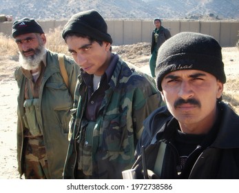 PAKTIA, AFGHANISTAN - January 10, 2007: Officers With The Afghan Border Patrol (ABP) Pose For A Photo In An Outpost Along The Disputed Afghan-Pakistan Boarder During The War In Afghanistan.