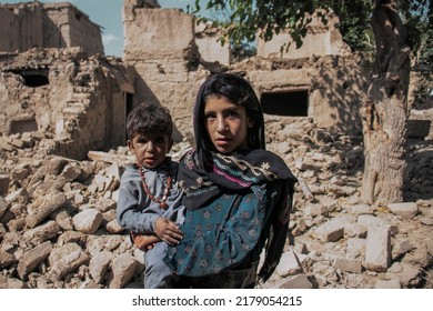 Paktika, Afghanistan - July 16, 2022: Sad Afghan Child After An Earthquake