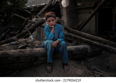 Paktika, Afghanistan - July 16, 2022: Sad Afghan Child After An Earthquake