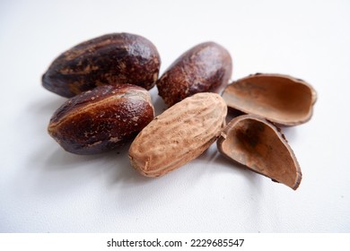 Pala, Nutmeg a pungent and warm, sweet tasting spice used to flavored baked good, puddings, potatoes, meats, sausages. - Shutterstock ID 2229685547
