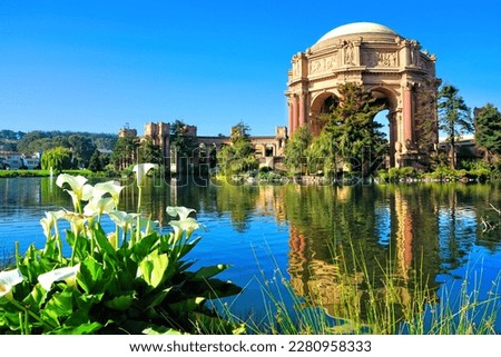 Palace of fine Arts with flowers and reflections under blue sky, San Francisco, California, USA