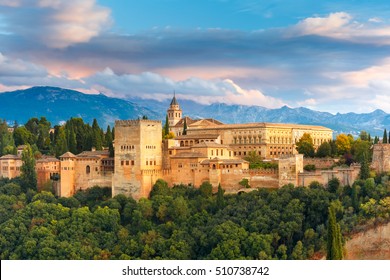 Palace and fortress complex Alhambra with Comares Tower, Palacios Nazaries and Palace of Charles V during sunset in Granada, Andalusia, Spain