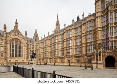 The Palace of Westminster (Houses of Parliament) facade with King Richard I statue in front, London, UK