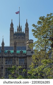 Palace Of Westminster With Union Jack Flag Flying At Half Mast