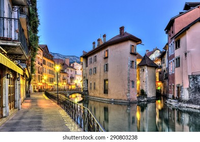 Palais de l'Ile jail and canal in Annecy old city by night, France, HDR