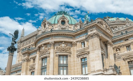 Palais or Opera Garnier The National Academy of Music timelapse in Paris, France. Side view looking up perspective with clouds on a blue sky