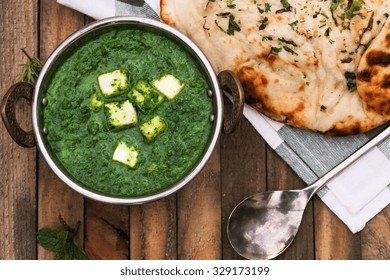 Palak Paneer And Garlic Naan Overhead View