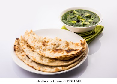 Palak paneer or Spinach and Cottage cheese curry is a healthy main course recipe in India, served with roti/chapati or naan, selective focus