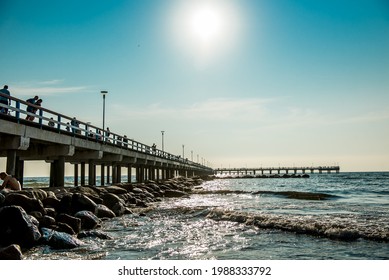 Palanga, Lithuania - 07.21.2018: Beautiful, long pier by the sea on a bright, sunny day in the city of Palanga, Lithuania. 