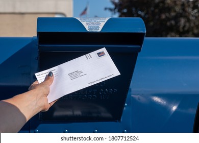 Palatine, IL/USA - 08-27-2020:  Mailing An Application For Ballot For 2020 Election At A Contactless Drive-up Mailbox At The US Post Office