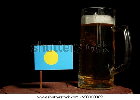 Palau flag with beer mug isolated on black background