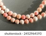 Pale pink beads from the queen conch (Lobatus gigas).