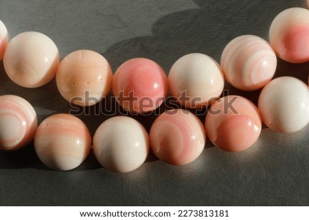 Pale pink beads from the queen conch (Lobatus gigas).