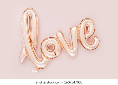 Pale pink Foil Balloons in the shape of the word 