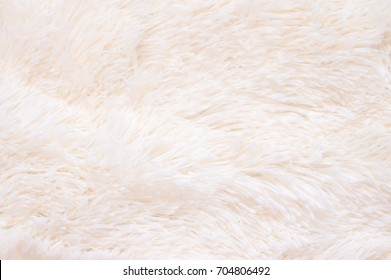 Pale Pink Shaggy Blanket Texture As Background. Fluffy Fake Textile Fur.